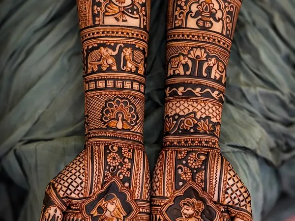 Latest bridal mehndi designs featuring royal dulhan motifs and intricate forearm artwork