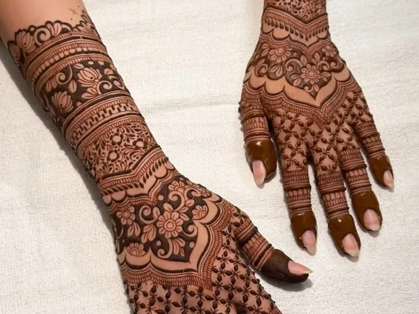 Elegant Arabic mehndi design featuring flowing floral vines and negative space styling
